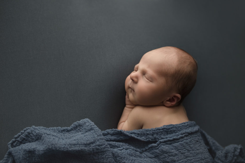 Sweet profile of a baby boy at his Lafayette newborn session.