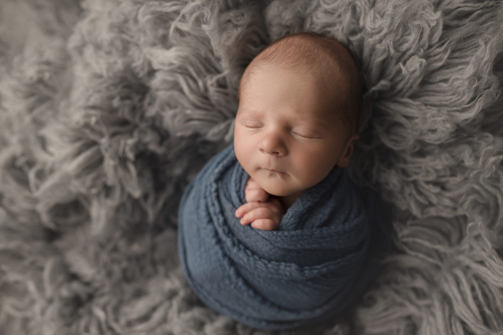 Sleeping boy at a newborn photography session in Lafayette Indiana.