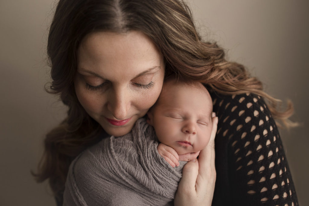 Sweet mama holding her baby boy at their Indianapolis newborn session.