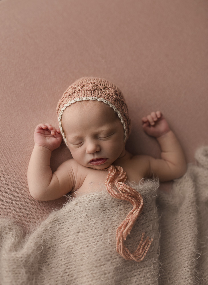 Newborn girl on a pretty back drop during her Indiana session.