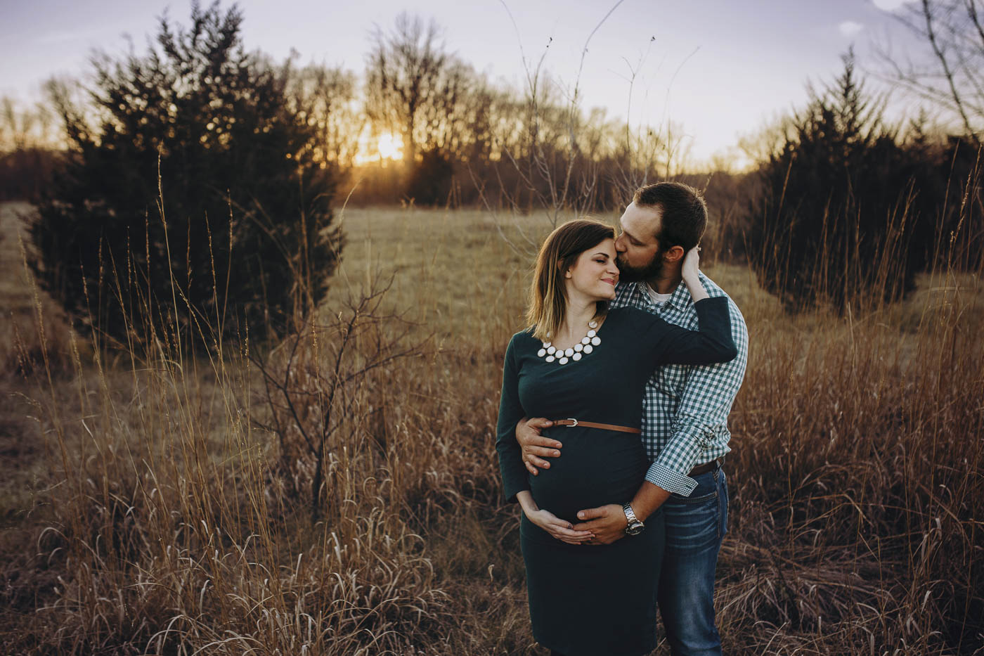 Sweet couple sharing a moment at their maternity photography session.