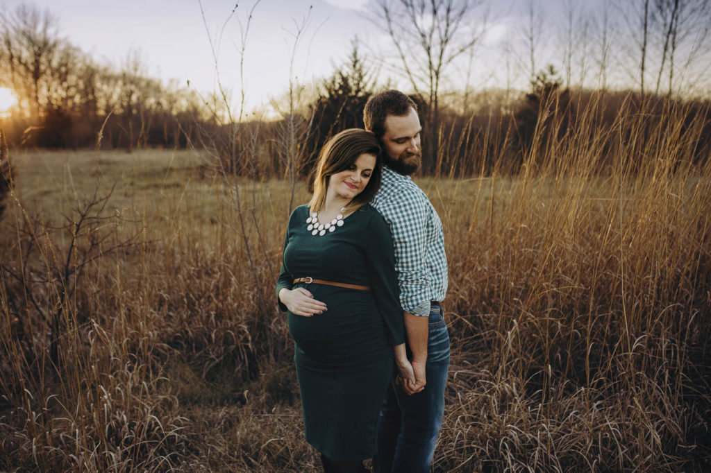 Couple posed during their maternity session in Lafayette.