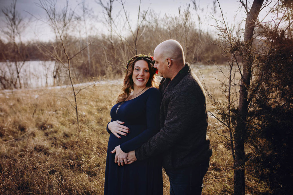 Sweet moment between husband and wife at their Indiana maternity session.