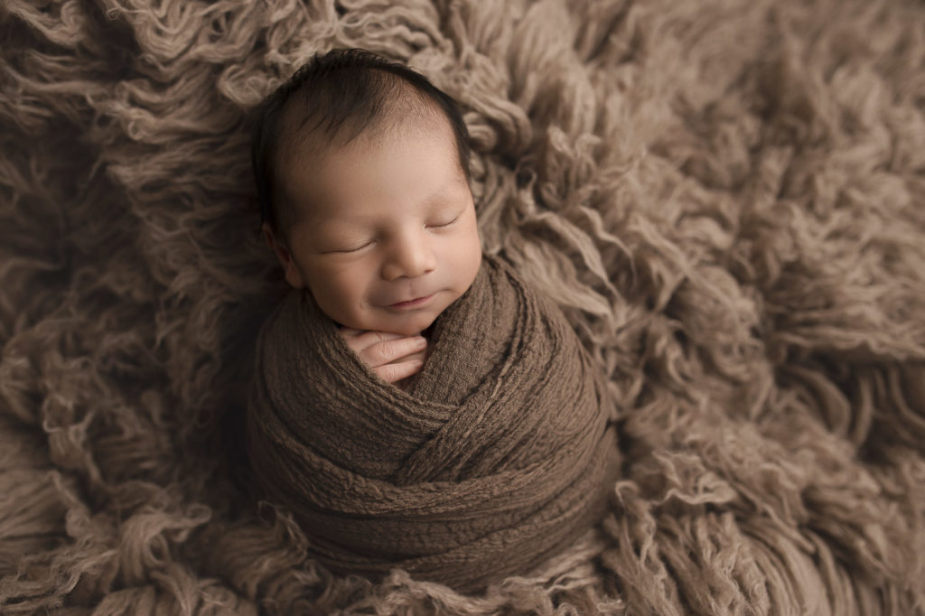 Sweet smile during his sleep for his newborn session.