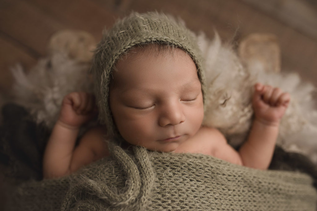 Close up of sweet baby boy's face at his Indiana newborn session.
