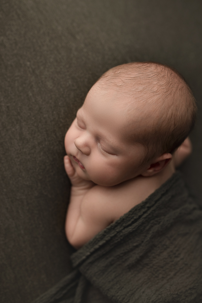 Adorable angle of baby boy at his newborn session in Lafayette Indiana.