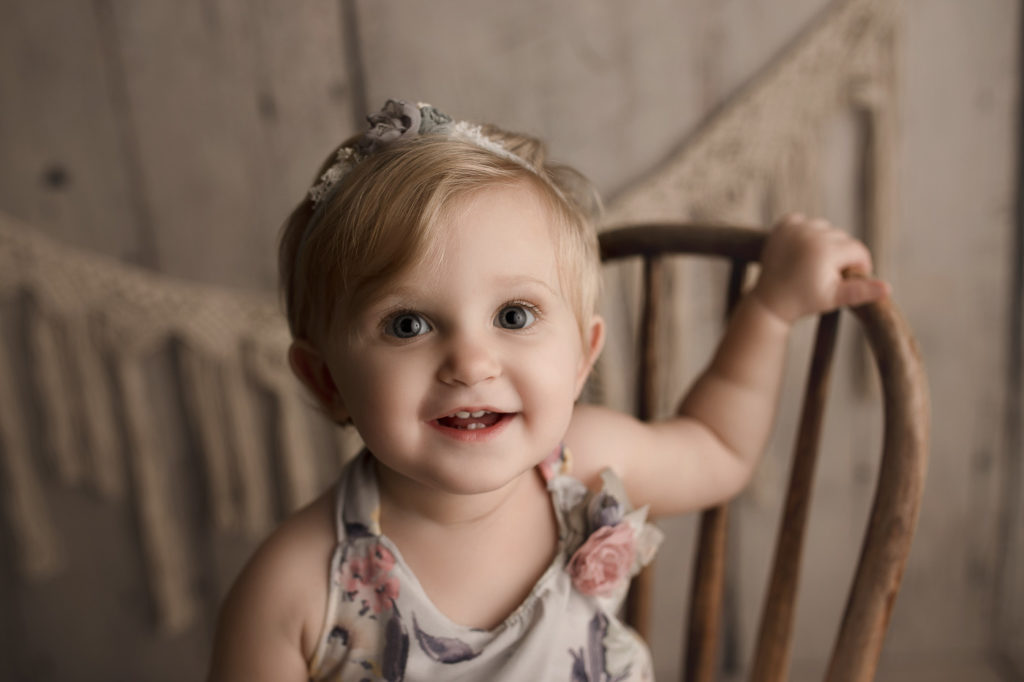 Smiley one year old girl at her Lafayette Indiana milestone session.