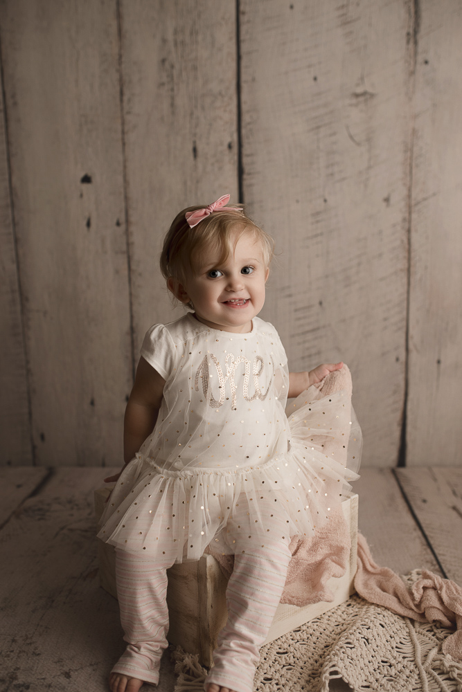 So cute wearing her birthday dress at her milestone session.