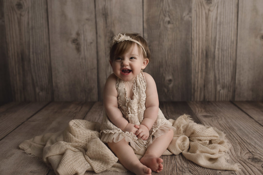 The happiest girl in town looking so cute at her first birthday session in Lafayette Indiana.
