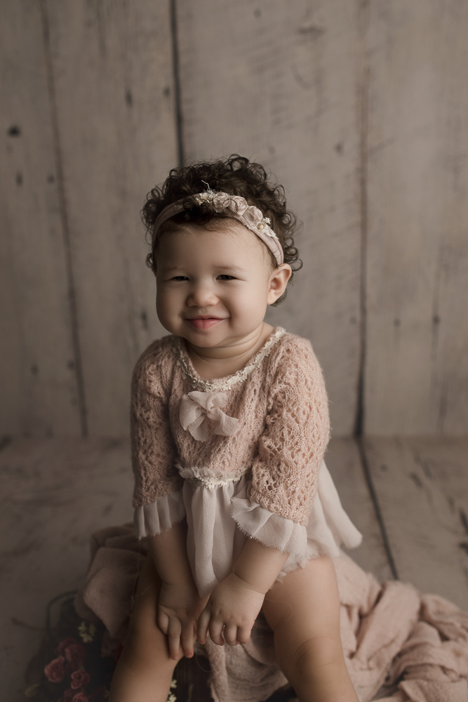 Little girl giving the cutest smiles at her Lafayette Indiana studio milestone session.