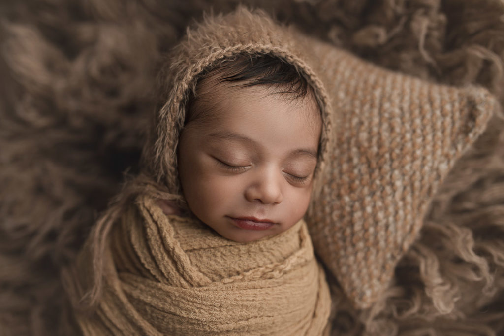 Snug as a bug during his newborn photo shoot.