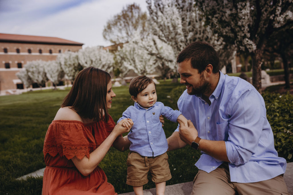 Trying to get their little boy to laugh at their West Lafayette family session.