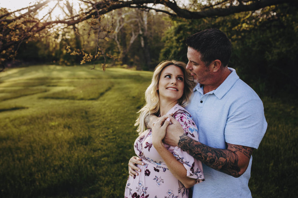 Couple sharing a special moment at their maternity session in Lafayette Indiana.