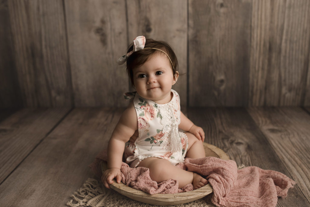 Eight month old girl during her studio milestone session in Lafayette Indiana.