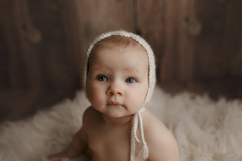 A close up shot during a milestone session for a baby girl.
