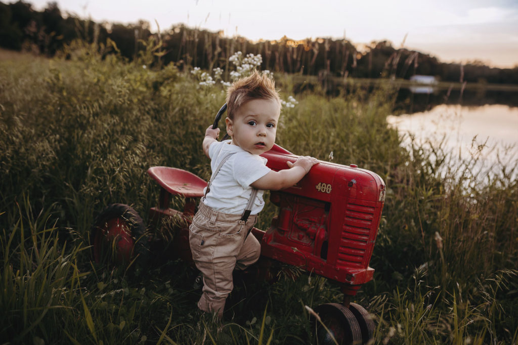 One year old with his tractor during his milestone session.