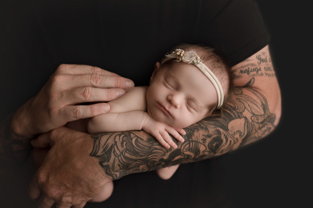 Lafayette Indiana studio newborn session with dad holding baby girl.