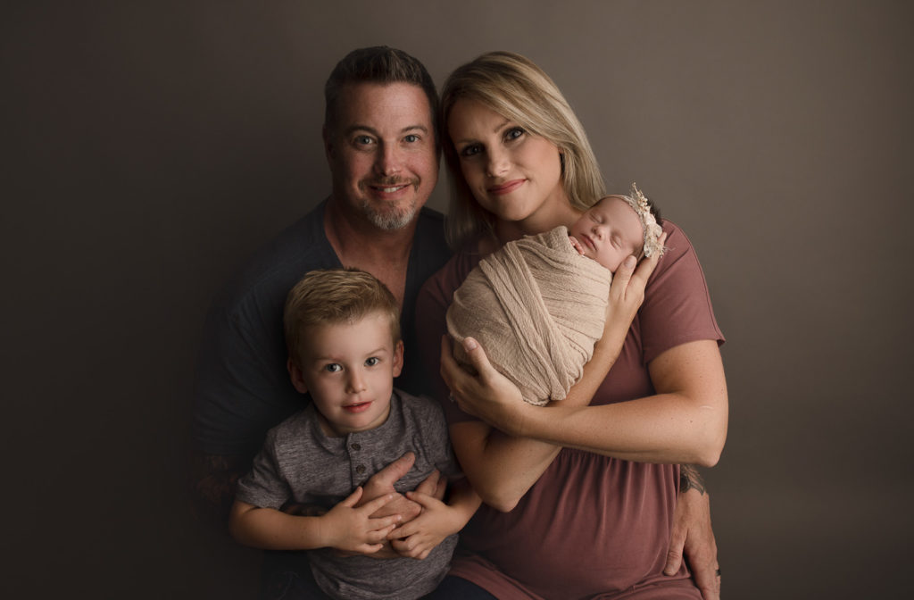 A cute family of four during their Lafayette Indiana studio newborn session.