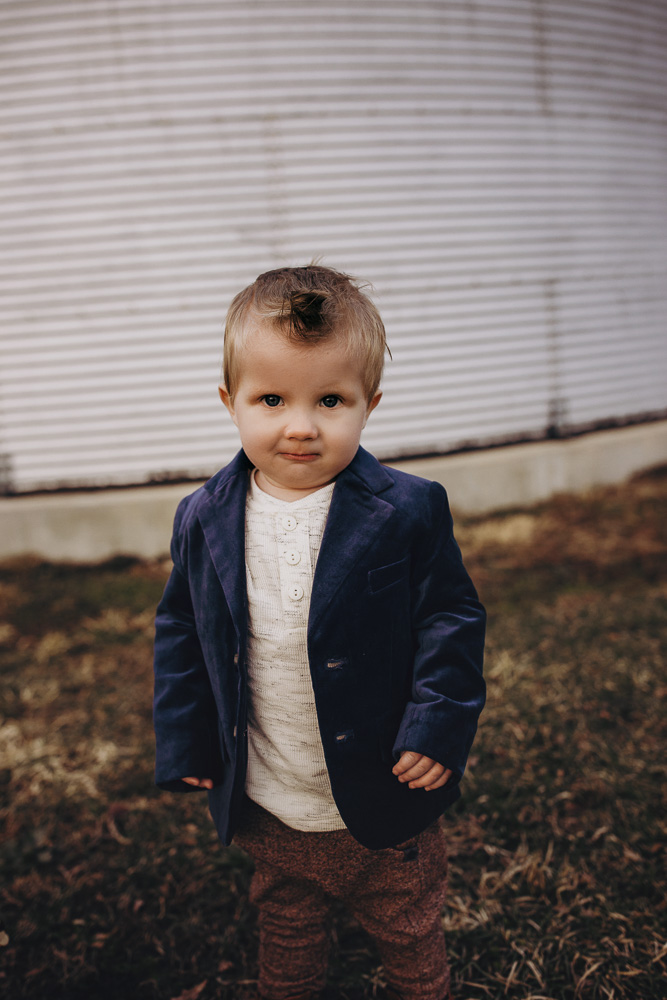 Sweet little boy during his families mini session on the tree farm.