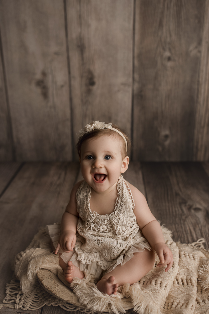 Little girl laughing at her Lafayette Indiana milestone session.