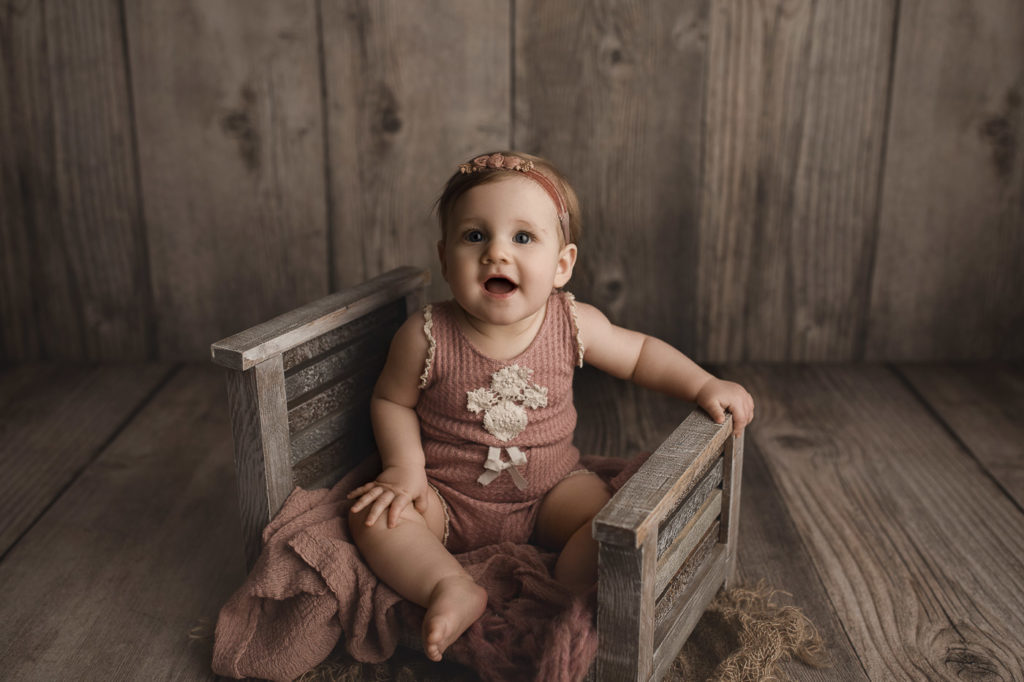 Making all the cute faces at her eight month milestone session in Lafayette Indiana.