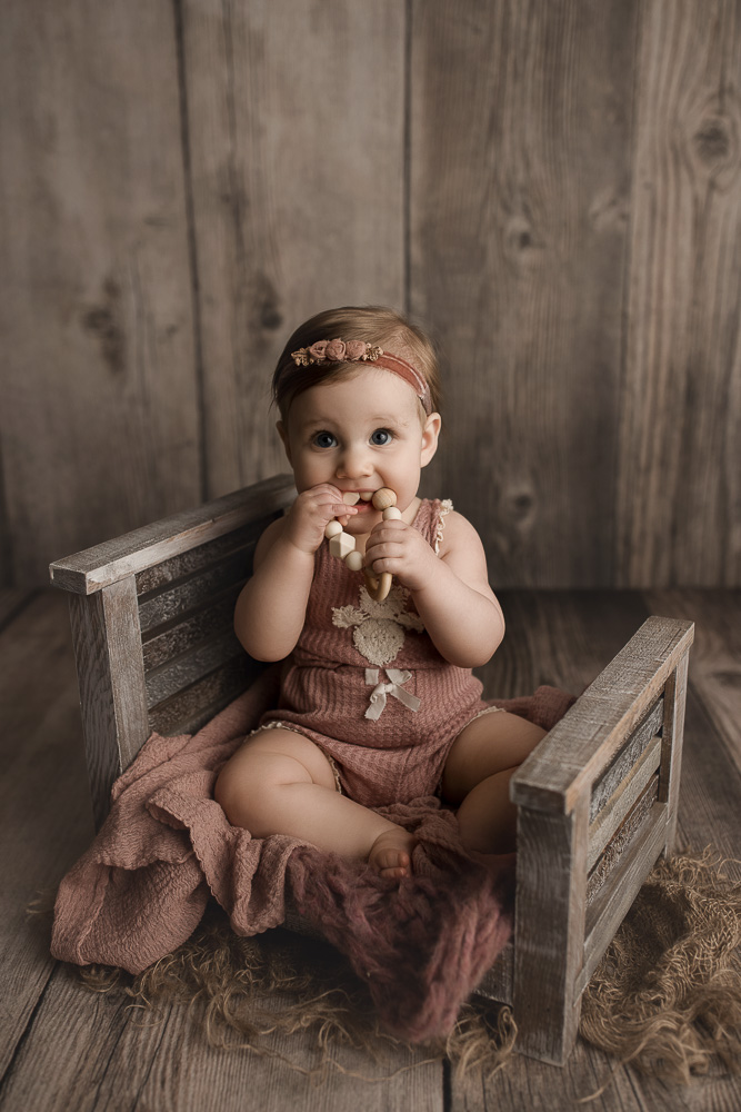 Teething baby looking so cute at a Lafayette baby photography session.