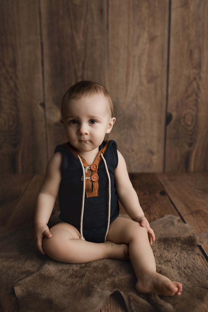 Cute baby boy during his one year studio milestone session in Indianapolis Indiana.
