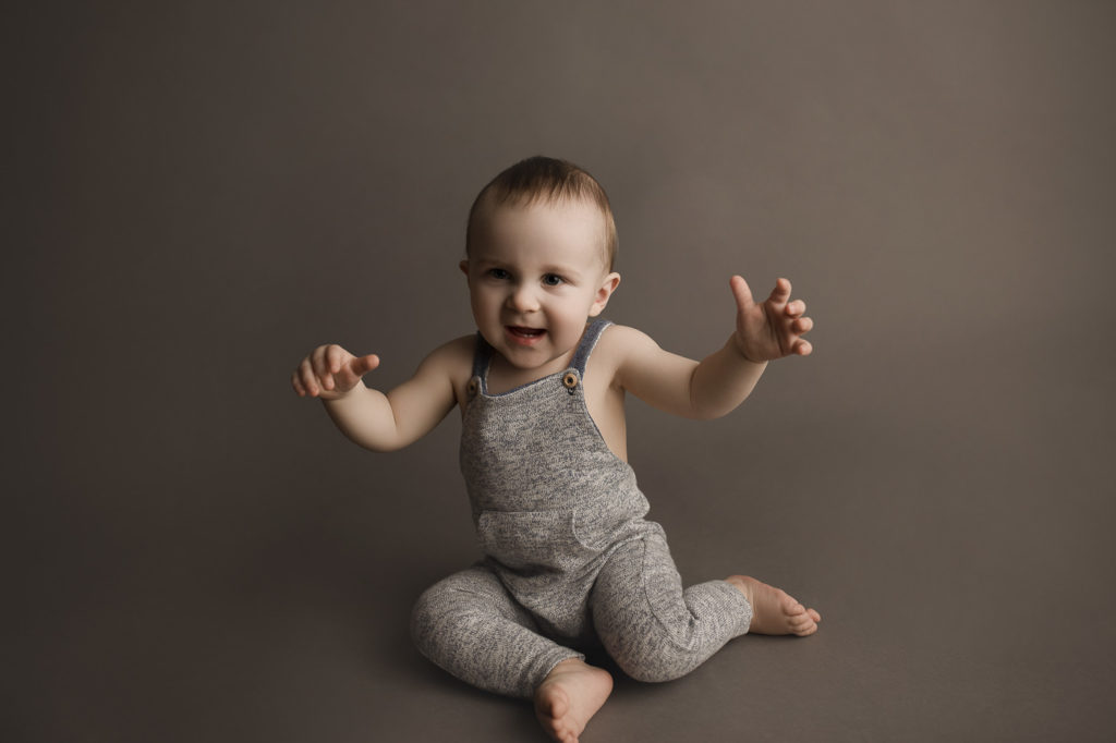 Excited little boy during his one year birthday milestone session in Indianapolis Indiana.