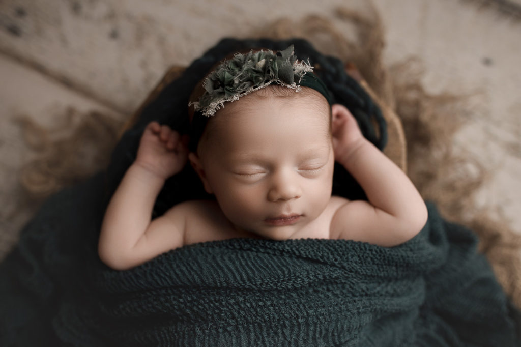 Looking adorable in teal for her studio newborn session in Indiana.